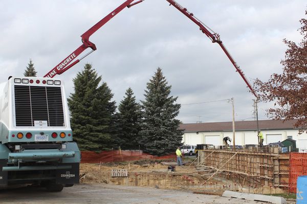 Crews work on Sluka Field building
